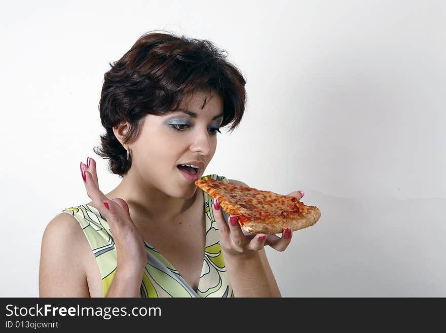 Sweet girl eating pizza slice