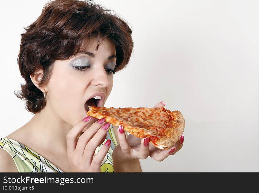 Sweet girl eating pizza slice