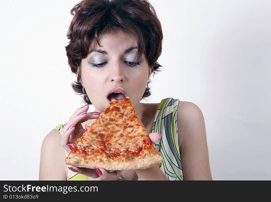 Sweet girl eating pizza slice