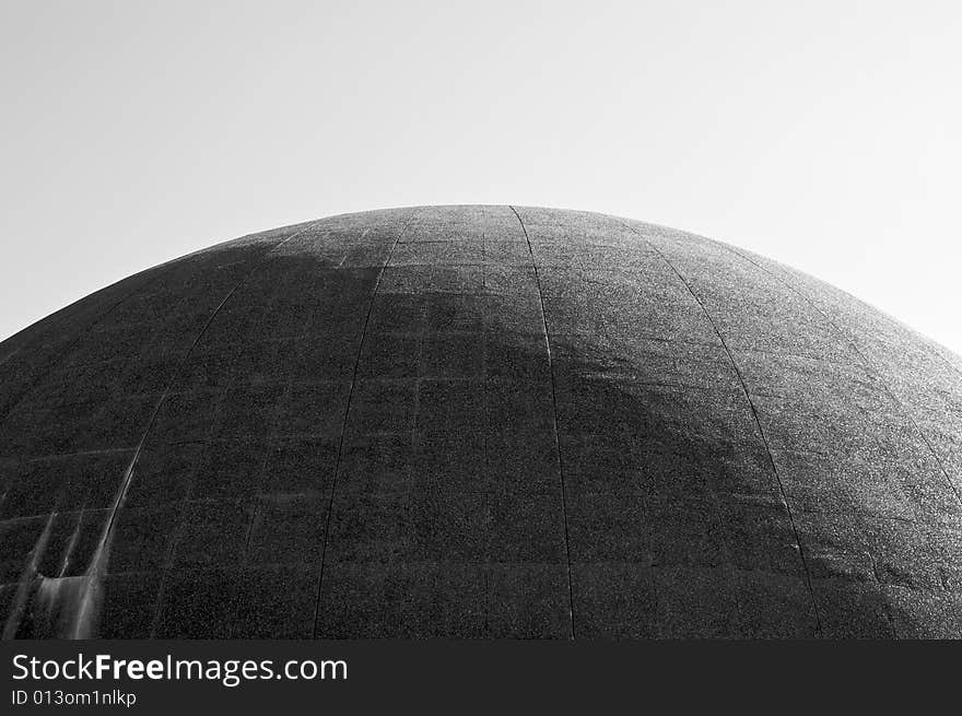 Large cement dome half in sunshine in black and white. Large cement dome half in sunshine in black and white