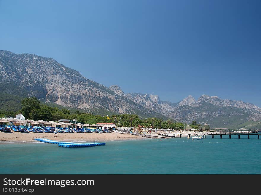 Blue sea and clear sky with mountains