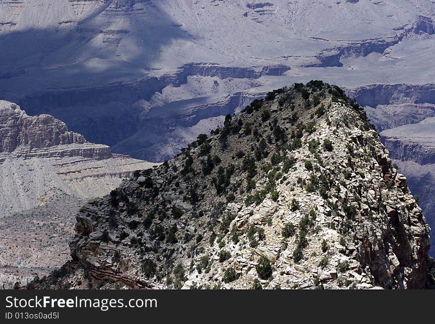 A peak rising from the canyon below. A peak rising from the canyon below.