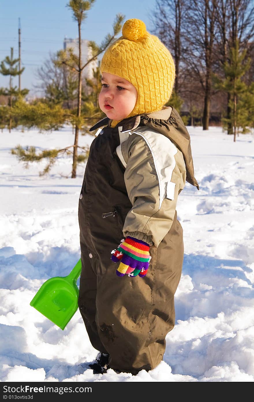 Thoughtful Baby With Shovel