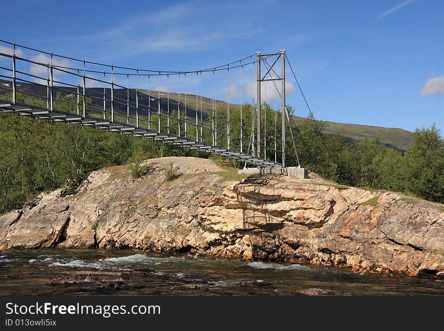 Suspended bridge in a national park, Sweden. Suspended bridge in a national park, Sweden