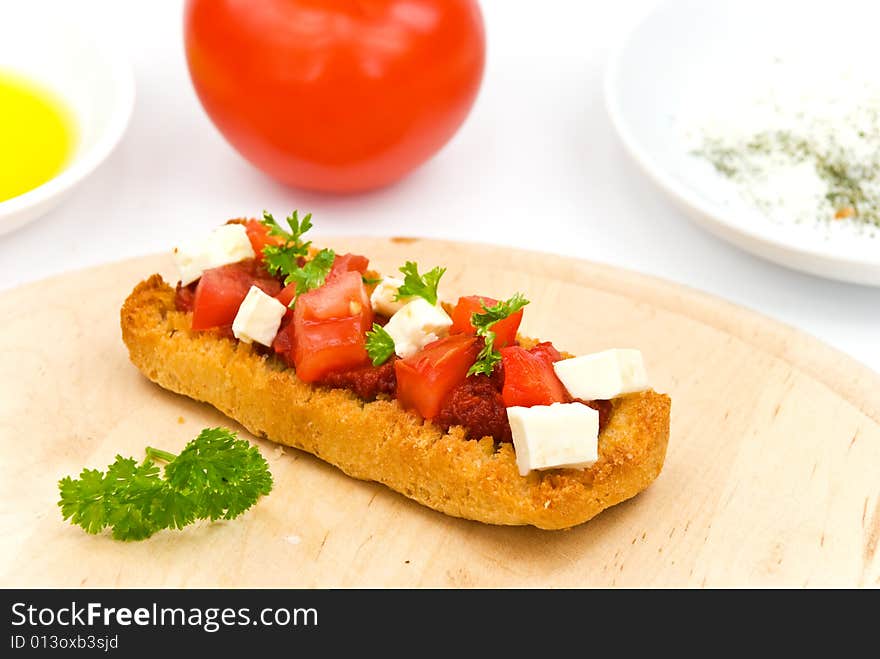 Bruschetta with tomato,cheese and other stuffing.