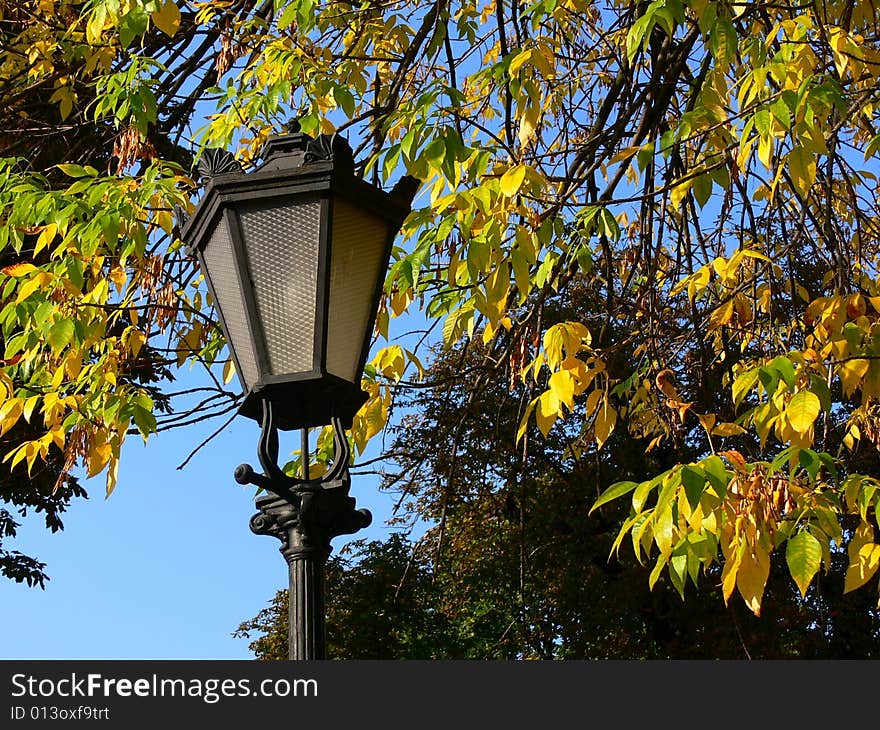 The Old-time torch in autumn park