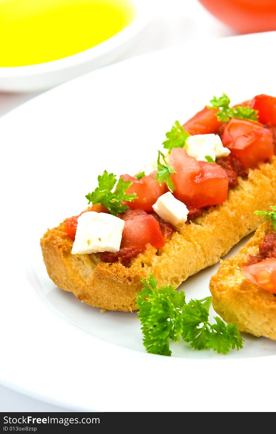 Bruschetta with tomato,cheese and other stuffing.