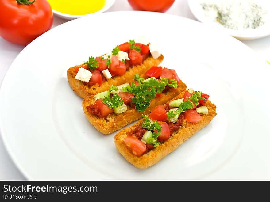 Bruschetta with tomato,cheese and other stuffing.