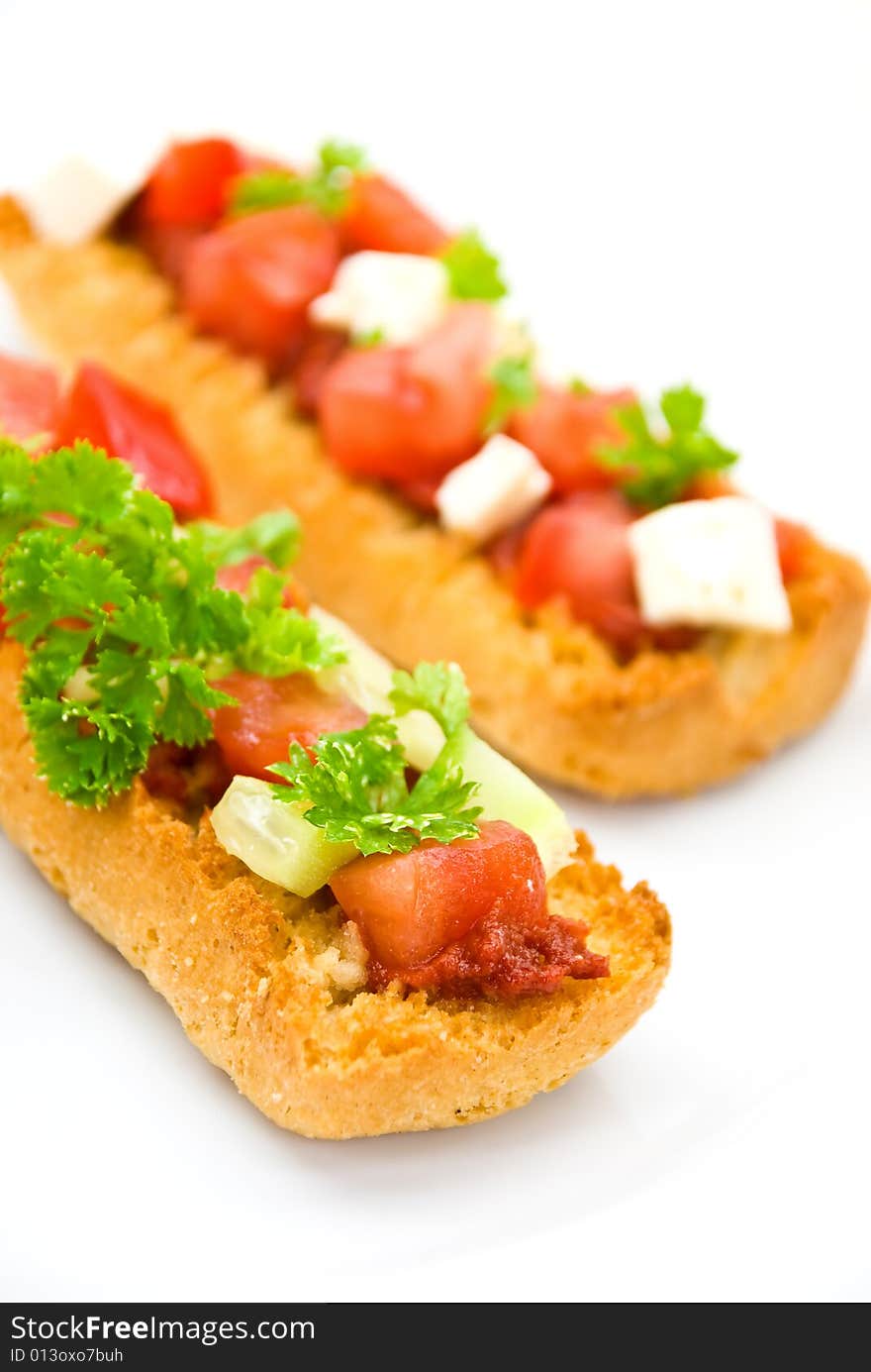 Bruschetta with tomato,cheese and other stuffing.