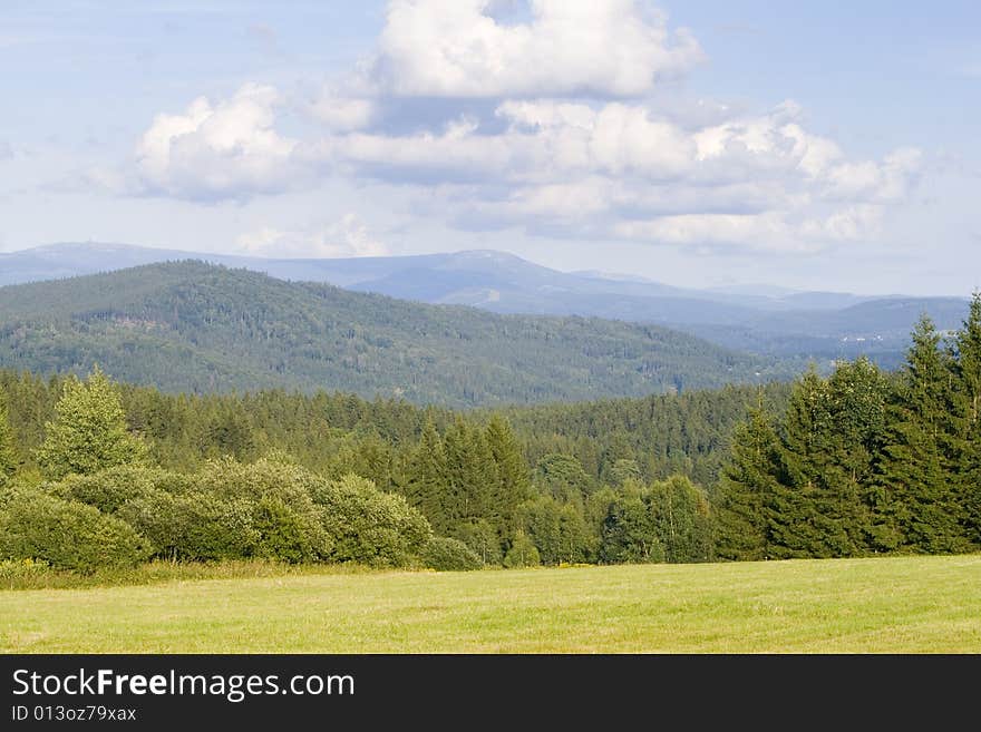 Mountain landscape in summer - Loc: 50°46'58.929N, 15°11'17.652E. Mountain landscape in summer - Loc: 50°46'58.929N, 15°11'17.652E