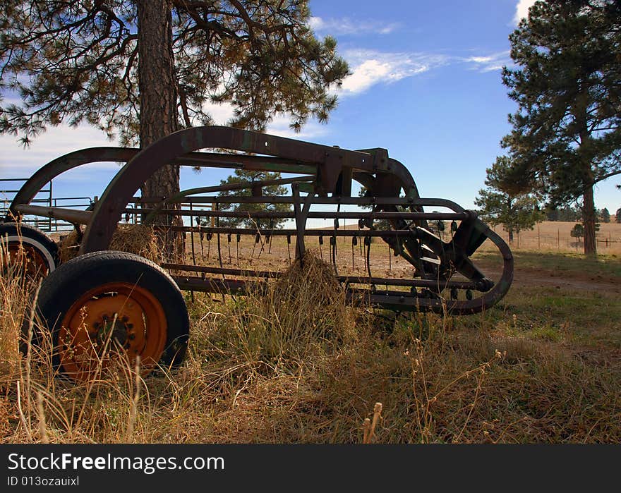 Old Rusty Antique Tractor Sitting in a Field