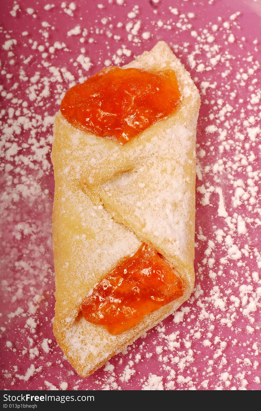 Overhead view of apricot kolache on a plate