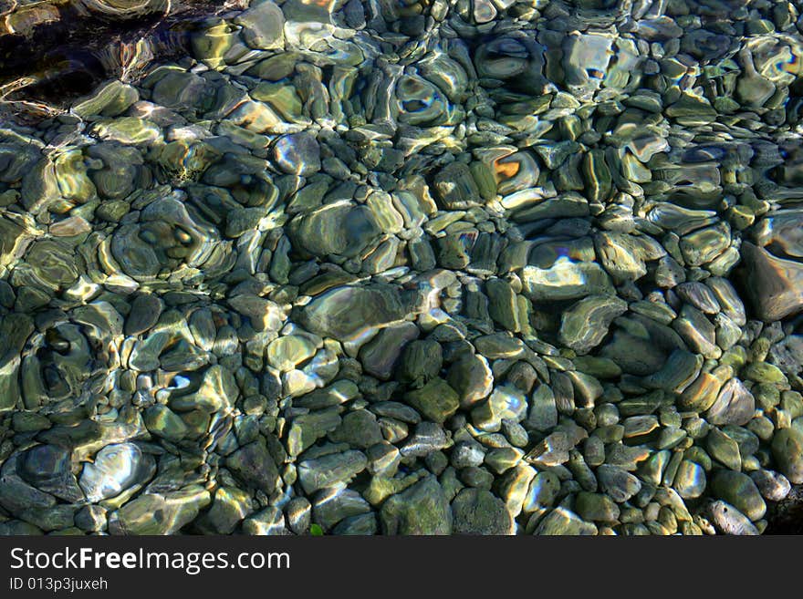 Sea water & stones, aquarium background. Transparent sea water white stones background relax. Sea water & stones, aquarium background. Transparent sea water white stones background relax