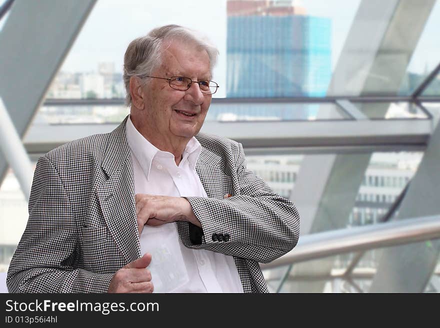 Portrait of a senior businessman smiling. Portrait of a senior businessman smiling