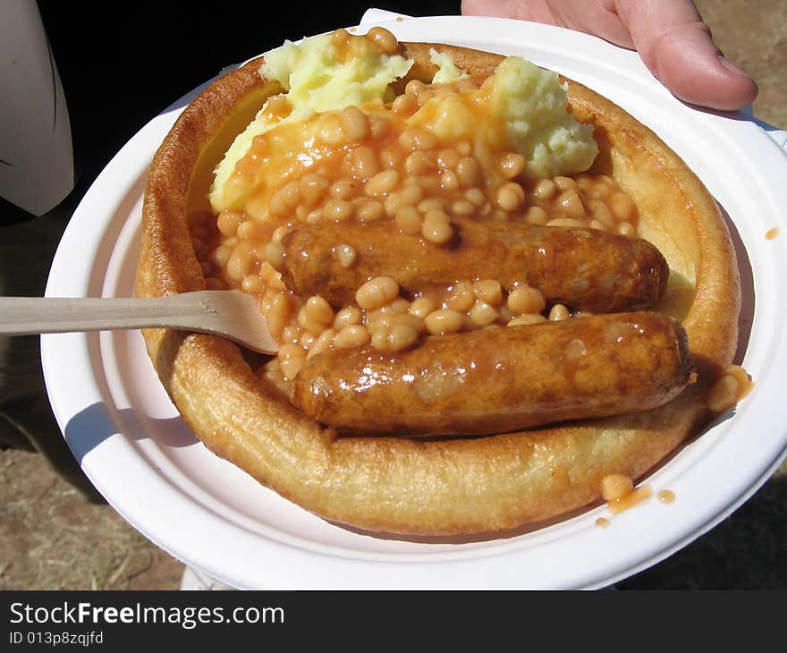 Bangers and mash on a paper plate