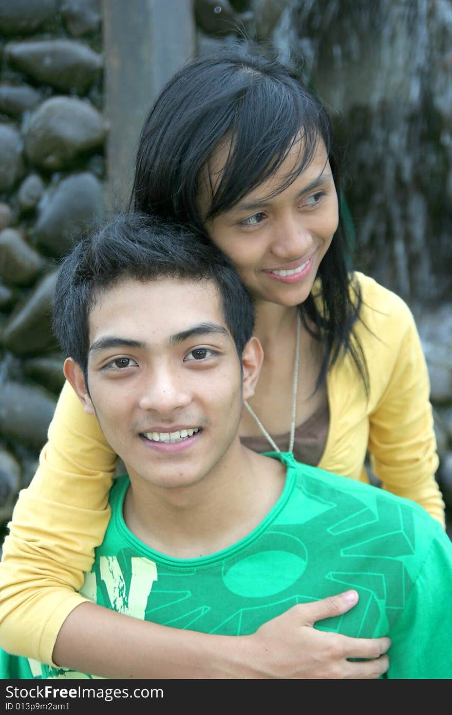 Young happy asian couple at park