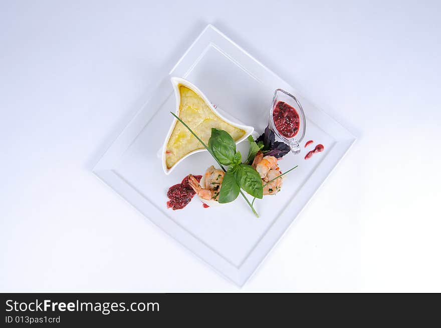 Plate of fine dining meal, halibut with vegetables