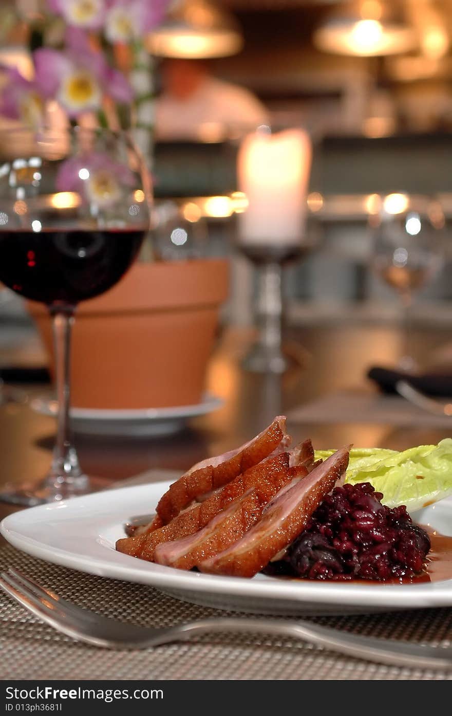 Sliced pork loin over lentils and beets