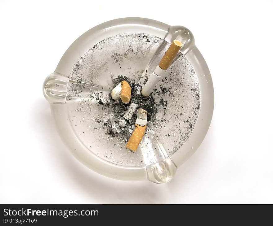 Ashtray and stubs on white background