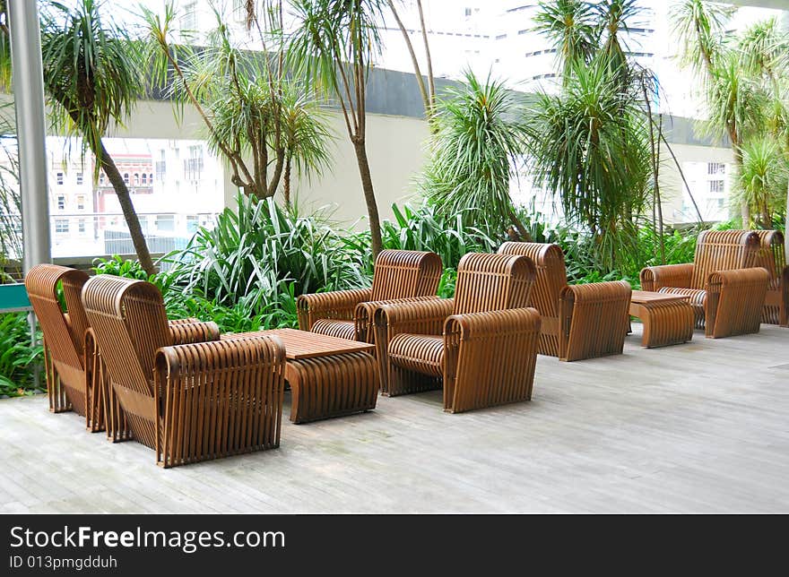 Business patio with curved wooden table and chairs