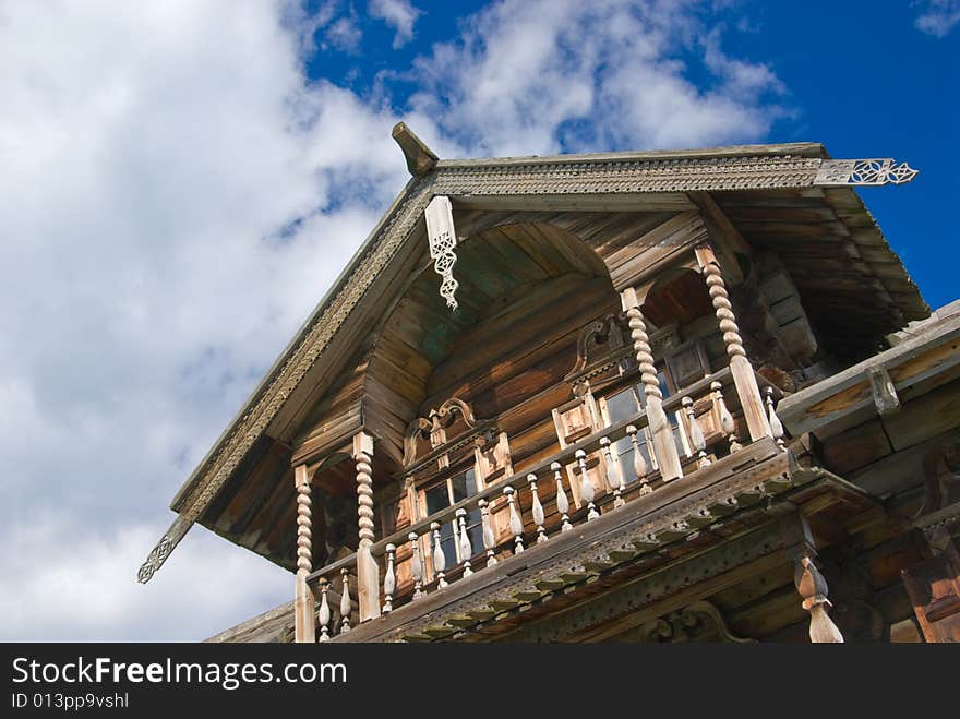 Very old and highly decorated loghouse in russian open-air museum