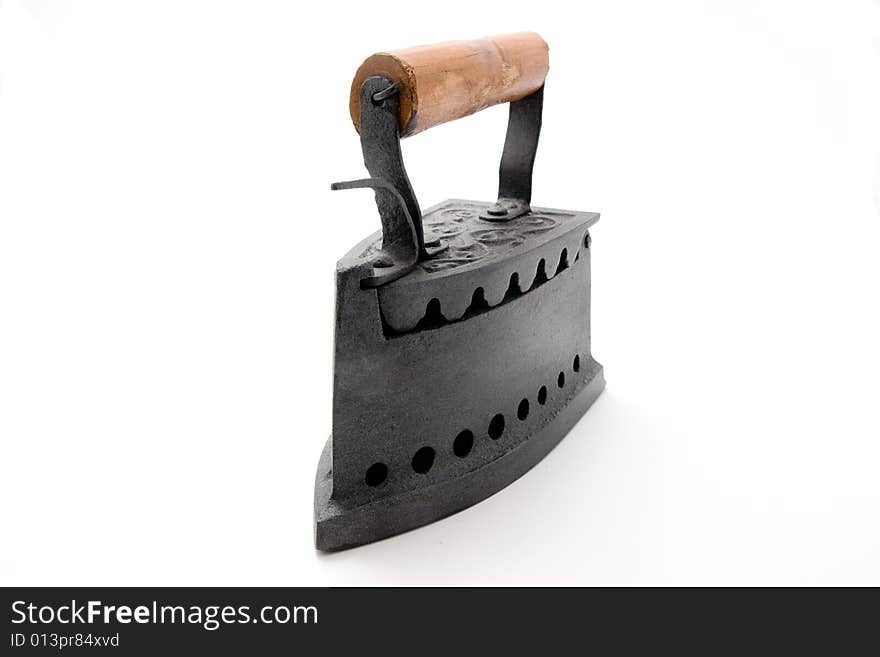 An old iron in a white background. An old iron in a white background