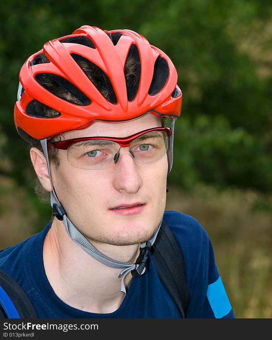 Portrait of cyclist in the protective helmet