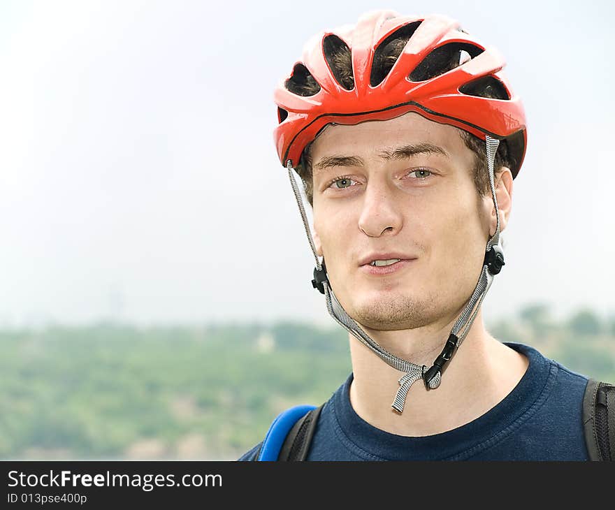 Portrait of cyclist in the protective helmet