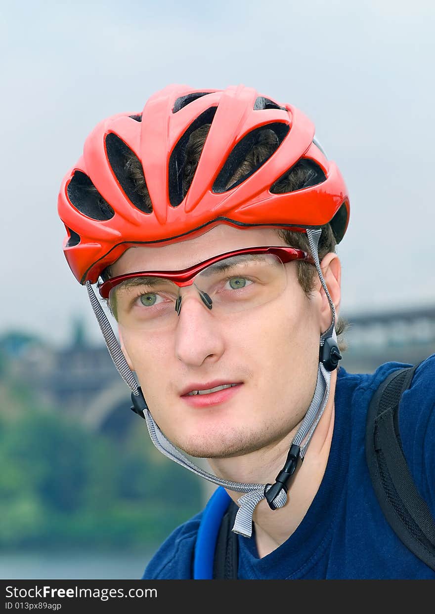 Portrait of cyclist in the protective helmet