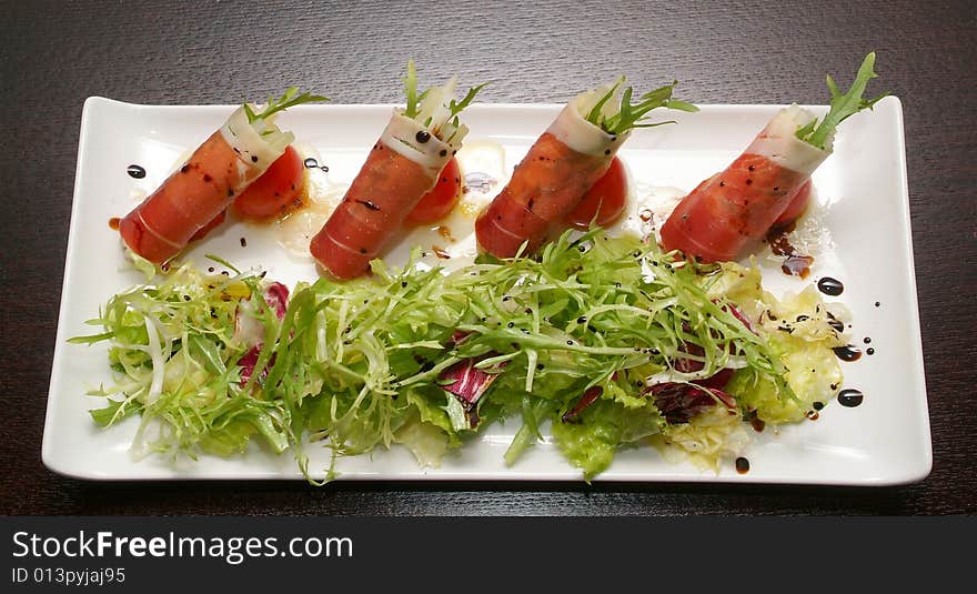 Salad from a salty herring with vegetables