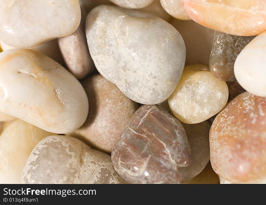 Closeup of a pile of sea pebbles (as a background)