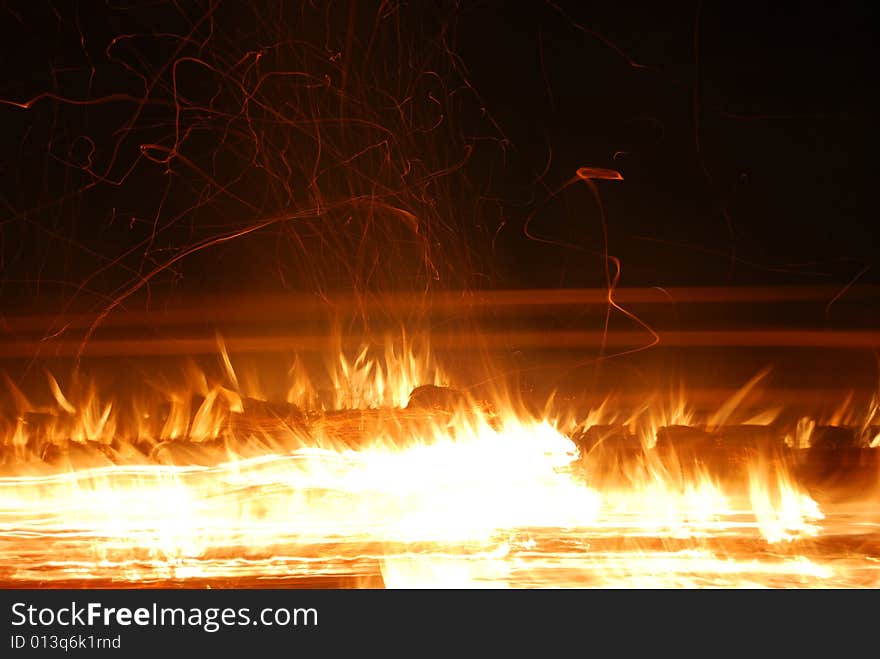 Long exposure on jumping bonfire