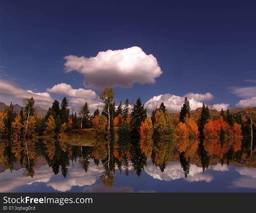 High mountain lake in the fall showing autumn colors reflected in the water
Americana. High mountain lake in the fall showing autumn colors reflected in the water
Americana