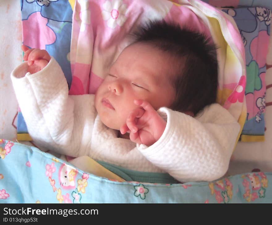 Sleeping Baby on a bed