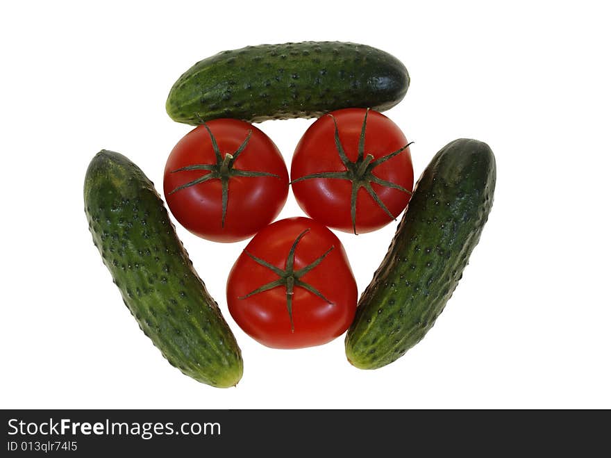 Tomatoes and cucumbers arranged isolated on white background