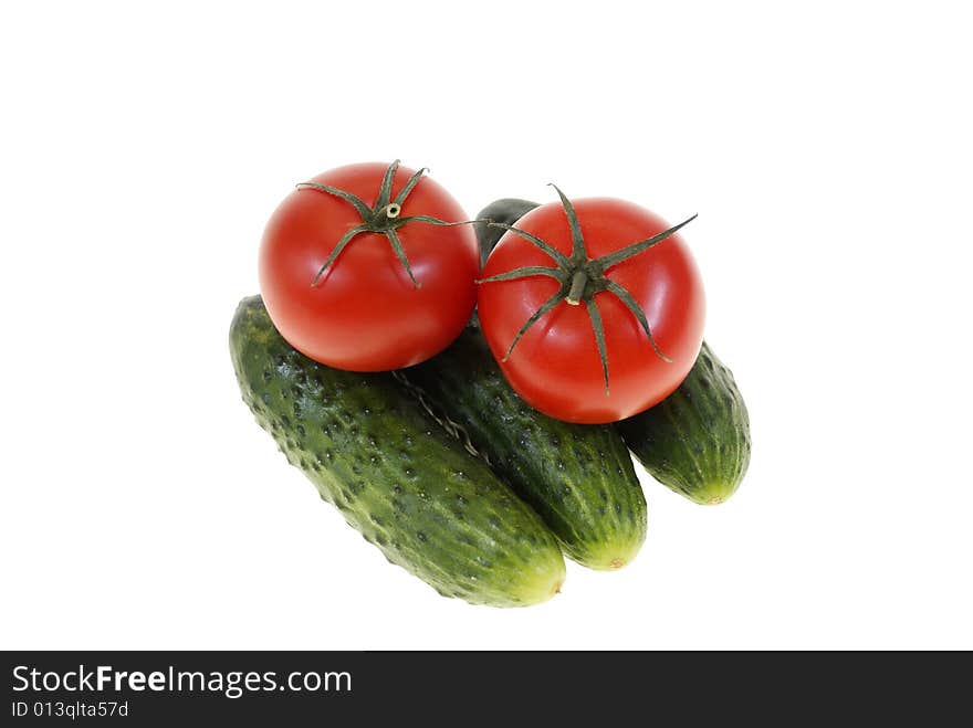 Tomatoes and cucumbers isolated on white background