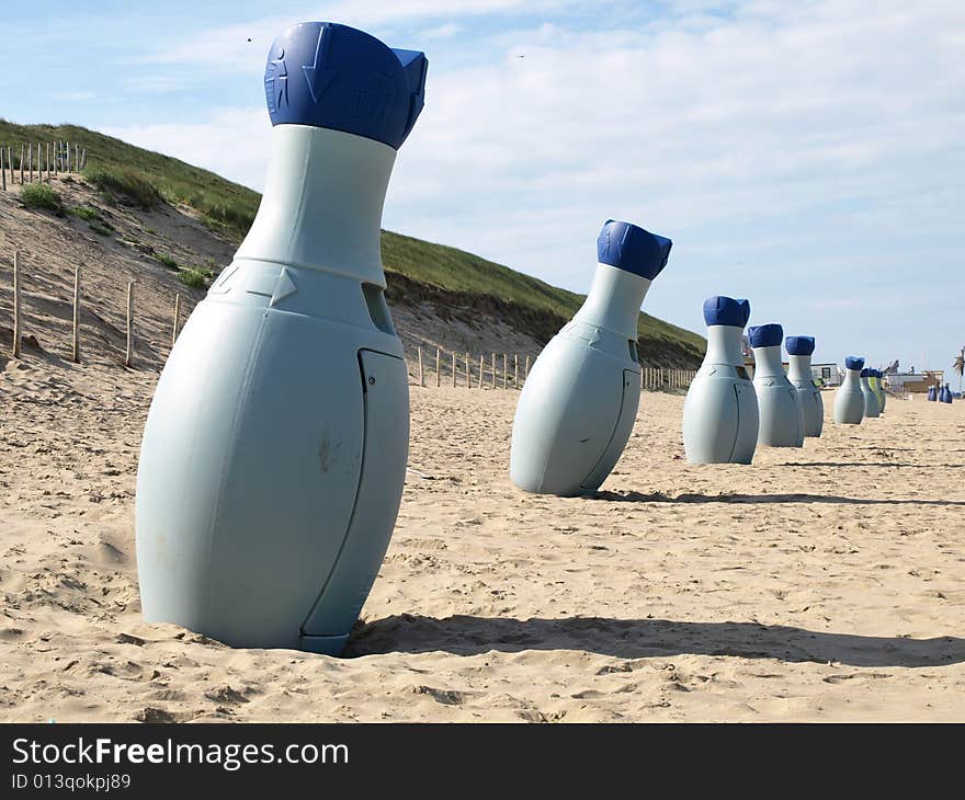 Garbage bottles on the beach in Holland in line. Garbage bottles on the beach in Holland in line