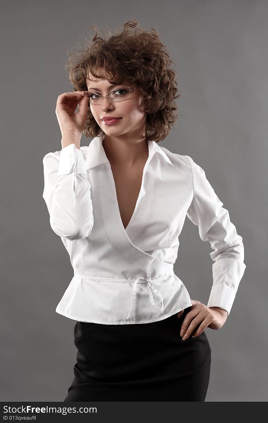 Young pretty businesswoman in glasses