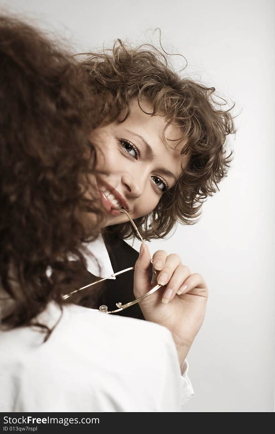 Young smiling businesswoman with glasses