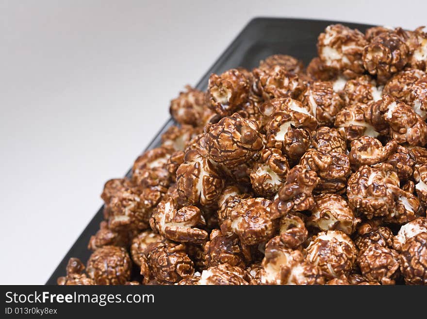 Brown color chocolate popcorn on neutral background