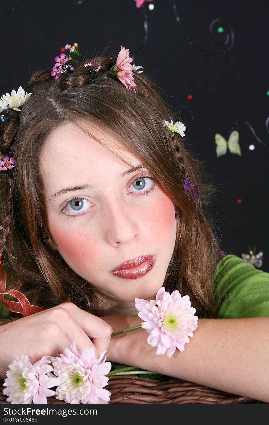 Teenage model with flowers and butterflies in her hair. Teenage model with flowers and butterflies in her hair