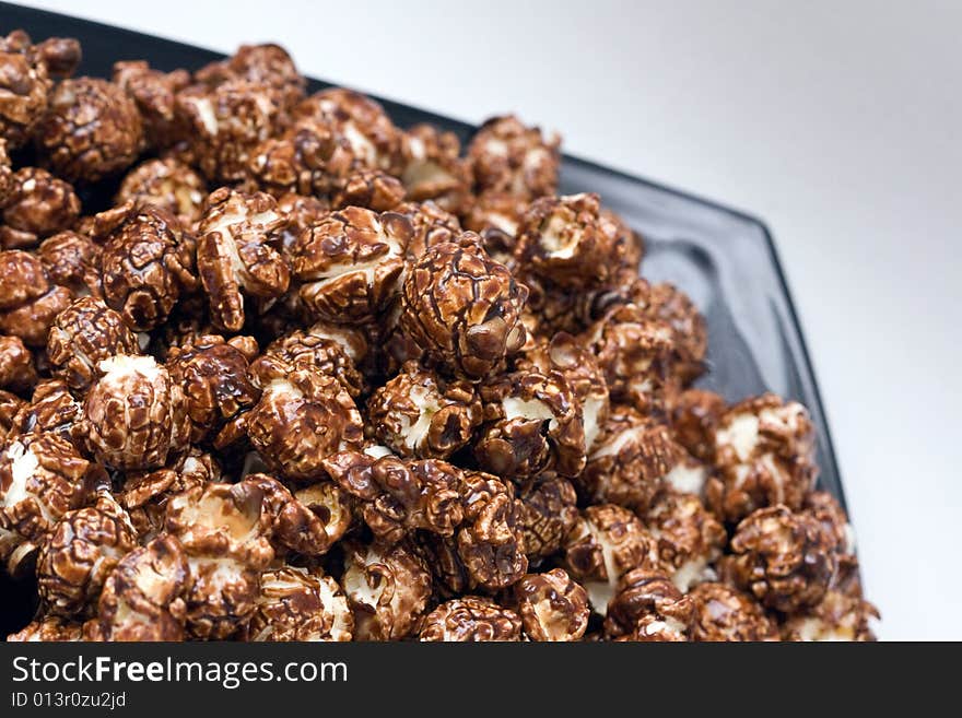 Brown color chocolate popcorn on neutral background