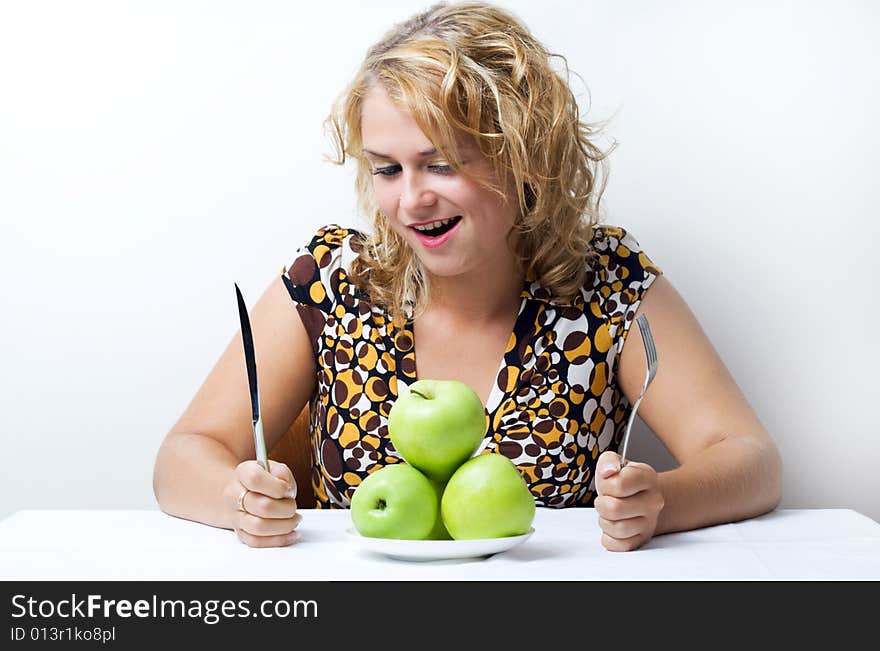 Young cute girl with green apples. Young cute girl with green apples.