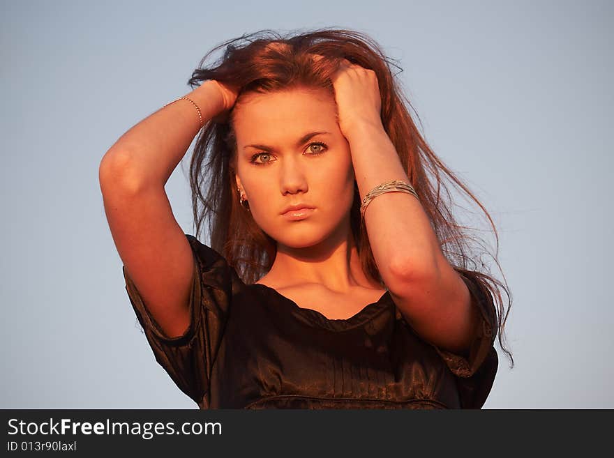 Portrait of a young lady in light of the evening sun