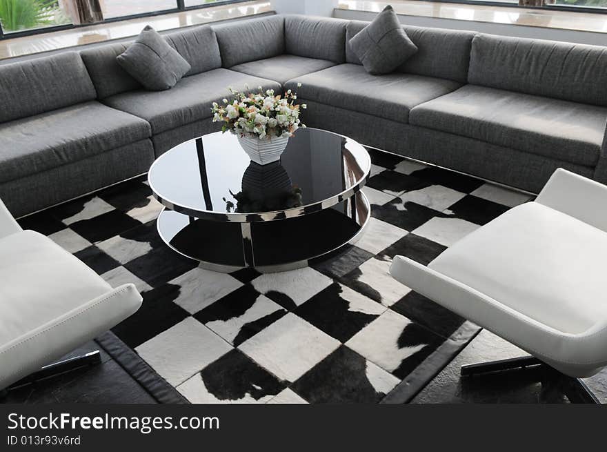 The cubic flanette sofa and round tea table in a company reception room. The cubic flanette sofa and round tea table in a company reception room.