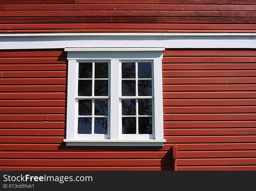 White Framed Window on a Red Barn. White Framed Window on a Red Barn