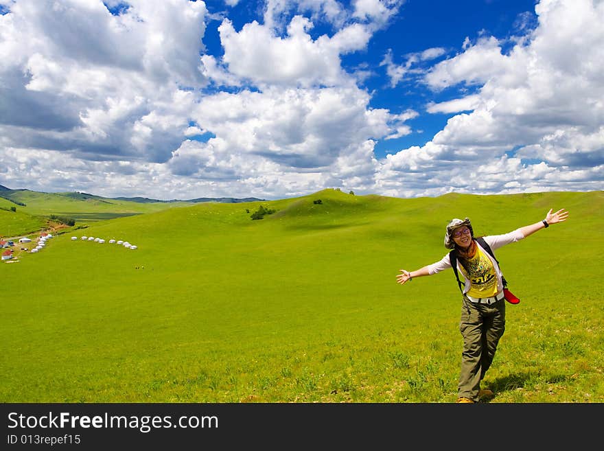 Happy girl on meadow,sky