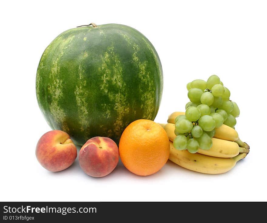 Green striped ripe 
watermelon and fruit on a white background