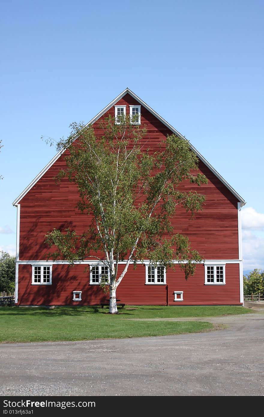 Large Red Barn With Blue Sky