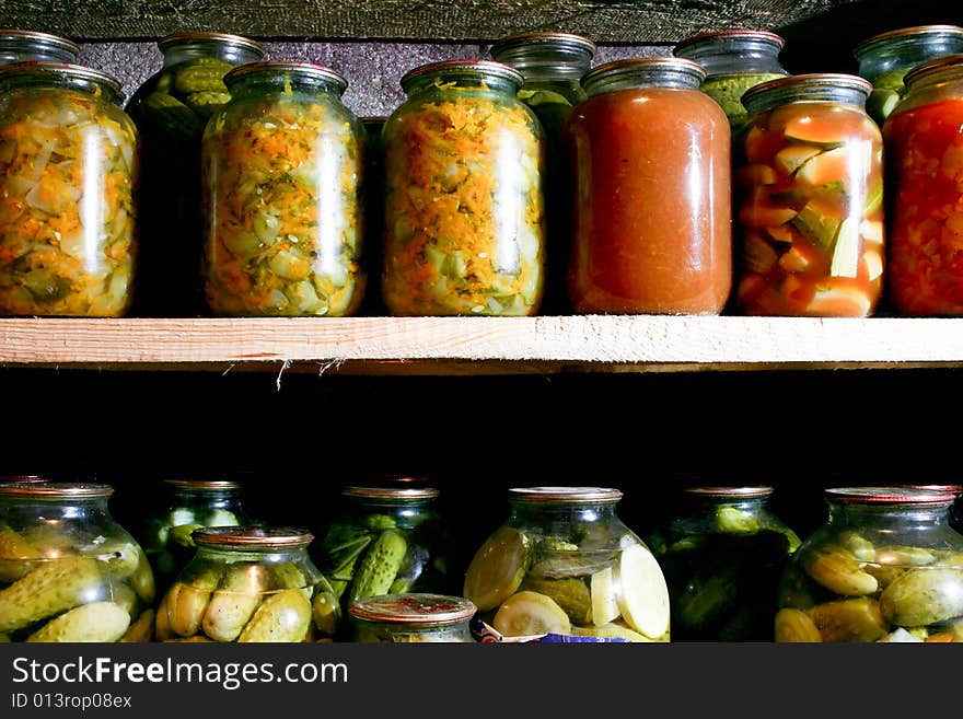 An image of bottles with vegetable in a row. An image of bottles with vegetable in a row